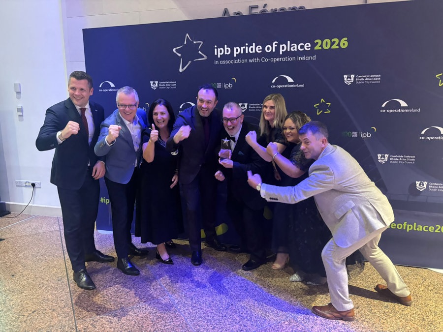 Kevin Moran and Stacy McVeigh of Dundalk Youth Centre receive the runners-up award in the Community Youth Initiative category at the IPB Pride of Place Awards 2026, alongside Cllr Dolores Minogue, Cathaoirleach of Louth County Council, council representatives and Co-operation Ireland officials.