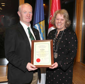 Paul Boyle accepts the award on behalf of the Louth Beekeepers Association from Cathaoirleach thumbnail