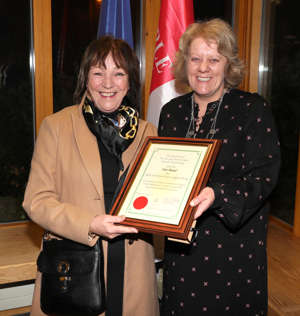 Rose McCusker accepts the award on behalf of Ardee and District Cancer Support Group thumbnail